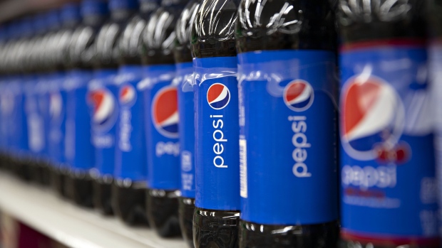 Bottles of PepsiCo Inc. Pepsi brand soda sit on display for sale at a supermarket in Princeton, Illinois, U.S., on Wednesday, April 17, 2019. PepsiCo is getting a boost from some of its classic brands. The snack and beverage giant posted quarterly results that beat estimates, sending shares to the highest since at least 1980. Photographer: Daniel Acker/Bloomberg
