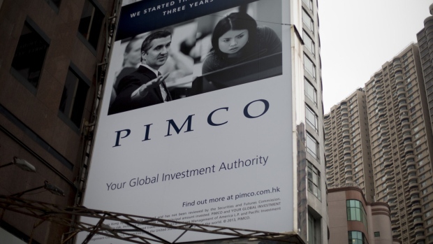A Pacific Investment Management Company LLC (PIMCO) advertisement is displayed on a building in Hong Kong, China. Photographer:Brent Lewin/Bloomberg 