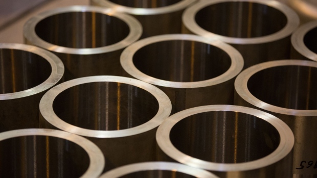 Hot-extruded tubes of titanium alloy sit after machining at the VSMPO-AVISMA Corp. plant in Verkhnyaya Salda, Russia, on Monday, May 14, 2018. The Russian company manufactures products of aluminum alloys, mill products of alloy steels, nickel-based alloys and supplies titanium alloys to Boeing Co. Photographer: Andrey Rudakov/Bloomberg