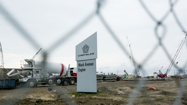 A sign reads "Mack Avenue Engine" outside the Fiat Chrysler Automobiles NV (FCA) Mack Avenue Assembly plant while under construction in Detroit, Michigan, U.S., on Tuesday, Aug. 13, 2019. FCA is investing $1.6 billion to convert the two plants that comprise the Mack Avenue Engine Complex into the future assembly site for the next-generation Jeep Grand Cherokee, as well as an all-new three-row full-size Jeep SUV and plug-in hybrid (PHEV) models, adding 3,850 new jobs to support production. Photographer: Anthony Lanzilote/Bloomberg