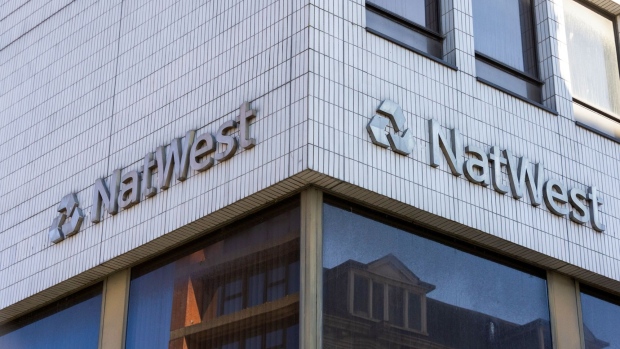 A sign above a NatWest Group Plc bank branch in Southend-on-Sea, U.K., on Monday, Feb. 14, 2022. European banks have largely thrived in the pandemic thanks to a flurry of dealmaking and unprecedented taxpayer support for the economy. Photographer: Chris Ratcliffe/Bloomberg