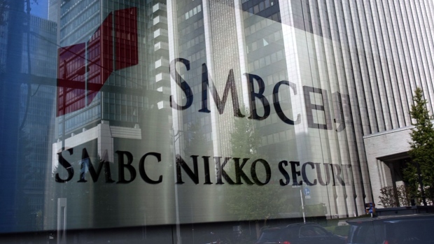 The logo of SMBC Nikko Securities Inc., a unit of Sumitomo Mitsui Financial Group Inc., outside its head office in Tokyo, Japan, on Monday, Nov. 8, 2021. SMBC Nikko has been dropped from a group of underwriters for a local corporate bond sale, after saying that employees are being probed by authorities. Photographer: Takaaki Iwabu/Bloomberg