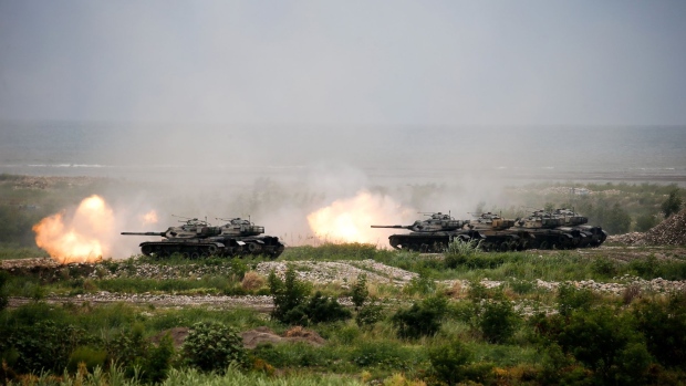 CM-34 Clouded Leopard eight-wheeled armored vehicles fire munitions during the Republic of China Armed Forces' annual Han Kuang military exercise in Taichung, Taiwan, on Thursday, July 16, 2020. With U.S.-China tensions increasing on a number of fronts, the main issue that could spark a military conflict over the long term is still one that is fundamental to their relationship: Taiwan.