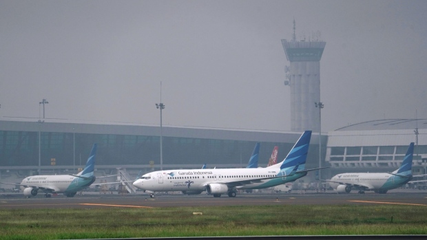 PT Garuda Indonesia aircraft at Soekarno-Hatta International Airport in Cengkareng, Indonesia, on Monday, May 24, 2021. Garuda Indonesia needs to completely restructure its business, potentially reducing the number of planes it operates to less than half its main fleet as the airline seeks to survive the crisis wrought by the pandemic, its president told staff last week. Photographer: Dimas Ardian/Bloomberg