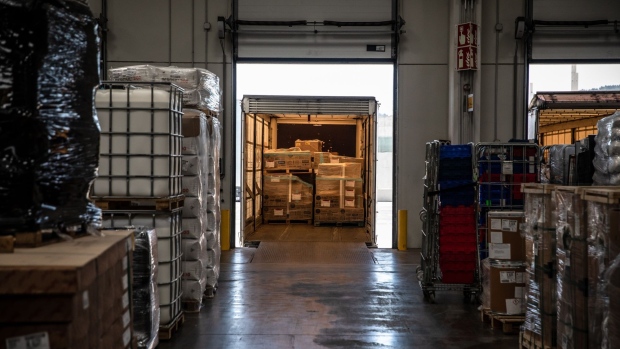 Pallets of goods loaded into a truck in a loading bay at an XPO Logistics Inc. distribution hub in Barcelona. Photographer: Angel Garcia/Bloomberg
