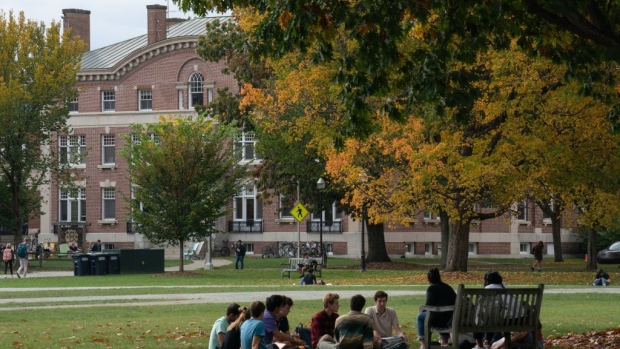 Students have class outdoors on the campus of Dartmouth College in Hanover, New Hampshire, U.S., on Friday, Oct. 15, 2021. Dartmouth Colleges endowment returned 47% in the fiscal year that ended in June, the latest university to post some of the strongest investment gains in decades.