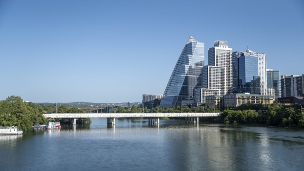 Waterfront buildings in Austin, Texas, US, on Tuesday, July 19, 2022. Record-breaking heat is set to scorch central US for another week and threaten Texas -- already in the bull’s eye for blistering weather -- with searing temperatures that may drive electricity demand to new heights.