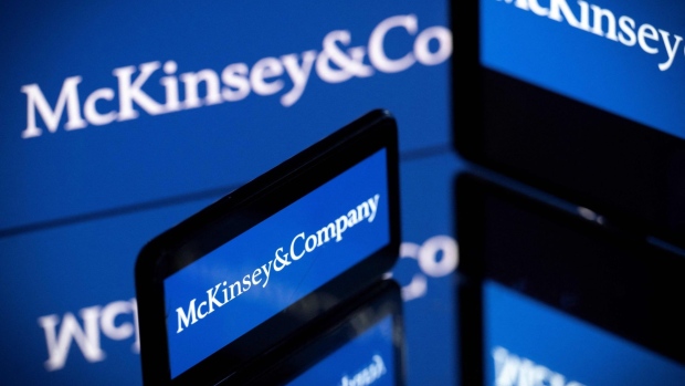 Screens displaying the logo of US-based McKinsey & Company management consulting firm. Photographer: Lionel Bonaventure/AFP/Getty Images