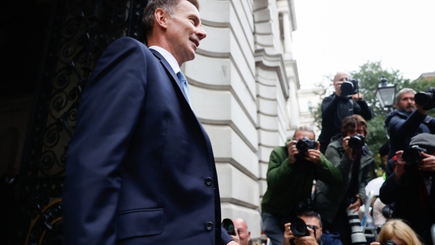 Jeremy Hunt, UK chancellor of the exchequer, arrives in Downing Street in London, UK, on Friday, Oct. 14, 2022. UK Prime Minister Liz Truss scrapped her plan to freeze corporation tax next year in another dramatic U-turn, hours after she fired her ally Kwasi Kwarteng and replaced him with Hunt as UK Chancellor of the Exchequer.