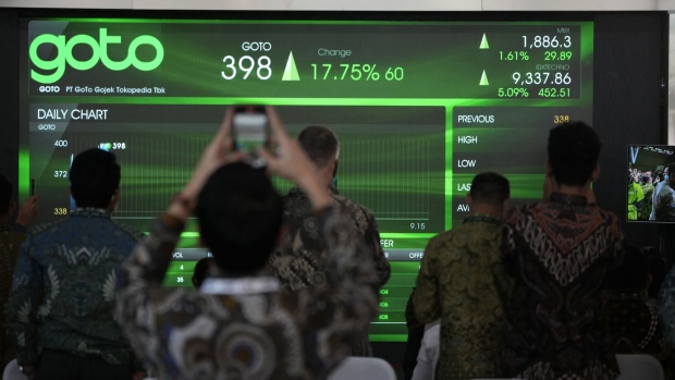 An electronic board displays stock prices of Goto Group at the lobby of the Indonesia Stock Exchange (IDX) in Jakarta, Indonesia, on Monday, April 11, 2022. GoTo, Indonesia’s biggest tech company, surged on its first day of trading after raising $1.1 billion in one of the world’s largest initial public offerings this year.