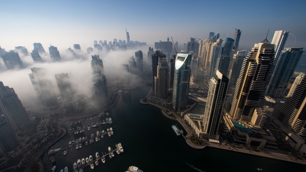 Morning fog shrouds residential and commercial skyscrapers in the Jumeirah Lake Towers and Dubai Marina districts of Dubai, United Arab Emirates, on Sunday, Jan. 17, 2021.  Photographer: Christopher Pike/Bloomberg