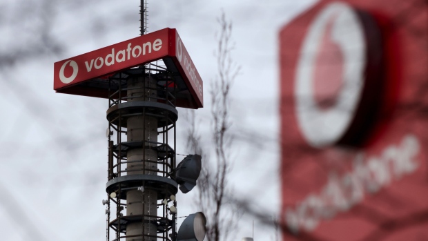 A Vodafone Group Plc logo on a telecommunications mast in Berlin, Germany, on Wednesday, Feb. 24, 2021. Vodafone plans to float a minority stake of its European towers unit Vantage Towers AG in Frankfurt, setting up what could be one of the region’s biggest initial public offerings this year.
