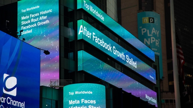 Meta news on screens at Morgan Stanley headquarters in New York, U.S., on Thursday, Feb. 3, 2022. Meta Platforms Inc.'s stock collapsed as much as 26% on Thursday morning, its biggest drop ever, after Facebooks user base faltered last quarter, the first stagnation in the company's history.
