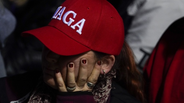 An attendee wears a 'MAGA' hat during a 'Save America' rally in Vandalia, Ohio, US, on Monday, Nov. 7, 2022. Former President Donald Trump suggested an announcement that he plans to make another White House bid is imminent and attacked Florida Governor Ron DeSantis at a rally in Pennsylvania, a sign the former president is training his ire on a potential chief rival in a 2024 GOP primary.