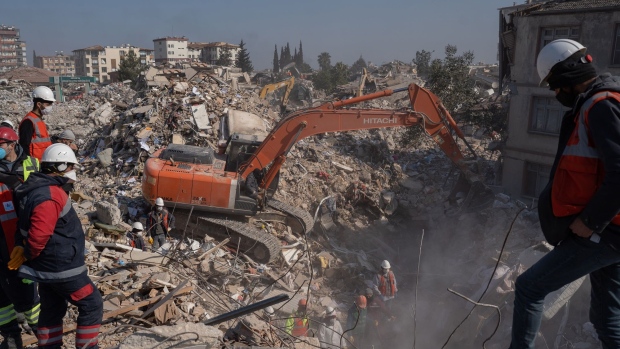 A rescue team works at the site of collapsed residential buildings in Hatay, Turkey, on Sunday, Feb. 12, 2023. The two massive earthquakes that killed over 24,000 people in Turkey are expected to result in an loss to the nation’s economy of over $84 billion, or about 10% of the GDP, according to estimates of the Turkish Enterprise and Business Confederation. Photographer: David Lombeida/Bloomberg