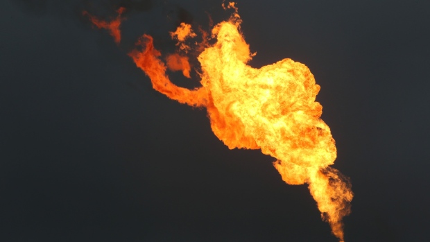 Flames from a gas flare burn at an oil flow station operated by Nigerian Agip Oil Co. Ltd. (NAOC), a division of Eni SpA, in Idu, Rivers State, Nigeria, on Monday, Sept. 28, 2015. Nigeria's daily output of about 2 million barrels of oil makes it Africa's largest producer. Photographer: Bloomberg/Bloomberg