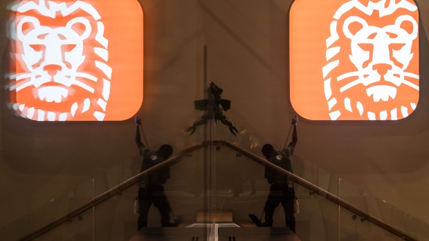 A worker cleans a staircase beside an illuminted ING Groep NV lion logo inside the bank's new Cedar campus headquarters at Cumulus Park in Amsterdam, Netherlands, on Tuesday, Jan. 7, 2020. The Dutch bank is scheduled to report full year earnings on February, 6. Photographer: Geert Vanden Wijngaert/Bloomberg