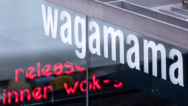 A sign sits above a Wagamama Ltd. restaurant in London, U.K. on Monday, Nov. 5, 2018. U.K. retail sales growth weakened in October after a summer of strong spending, according to the Confederation of British Industry. Photographer: Jason Alden/Bloomberg