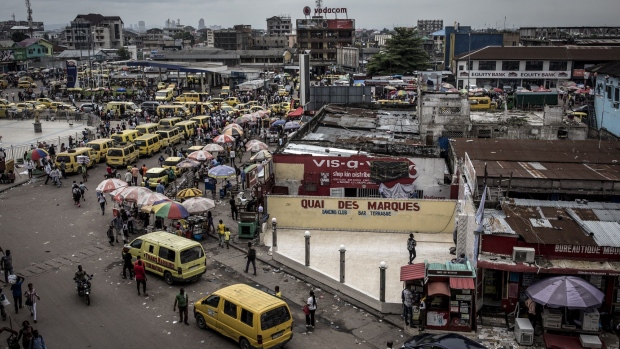 Yellow taxi van vehicles line the streets in the Victoire district of Kinshasa, Democratic Republic of the Congo, on Friday, Jan. 11, 2019. Photographer: John Wessels/Bloomberg