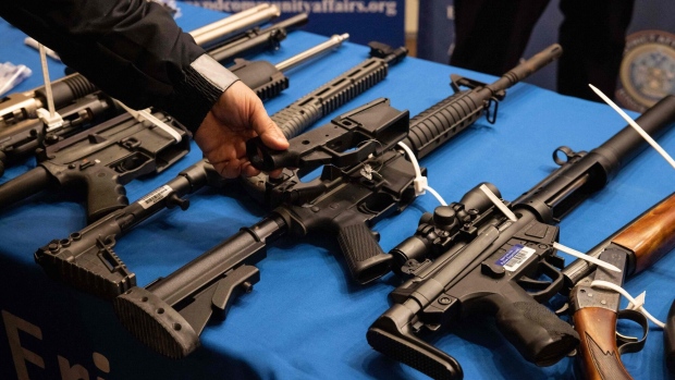 Handguns and firearms on display. Photographer: Yuki Iwamura/AFP/Getty Images