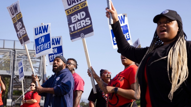United Auto Workers (UAW) members and supporters on a picket line outside the Ford Motor Co. Chicago Assembly Plant in Chicago, Illinois, US, on Saturday, Sept. 30, 2023. The United Auto Workers expanded its strike against General Motors Co. and Ford Motor Co. to more assembly plants, but the union spared Jeep maker Stellantis NV from additional walkouts after a last minute breakthrough.