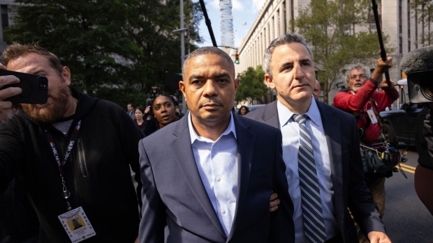 Jose Uribe, center, exits federal court in New York on Sept. 27.