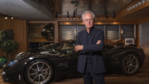 Horacio Pagani, founder of Pagani Automobili SpA, with the Utopia supercar at the company's showroom in Hong Kong, China, on Thursday, Nov. 23, 2023. Photographer: Chan Long Hei/Bloomberg