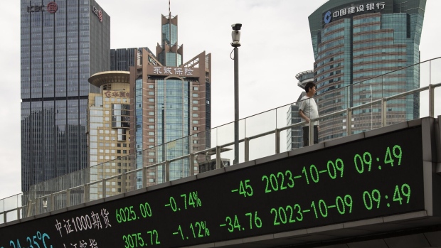 An electronic ticker displays stock figures in Pudong's Lujiazui Financial District in Shanghai, China, on Monday, Oct. 9, 2023. Chinese stocks edged lower as traders returned from the Golden Week holidays, with tourism data trailing some expectations and global uncertainties denting sentiment. Photographer: Qilai Shen/Bloomberg