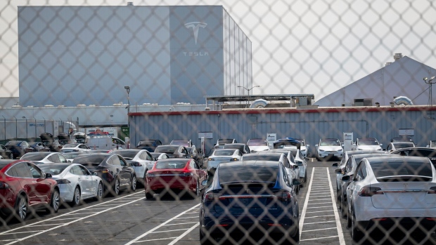 Tesla Inc. vehicles in a lot at the company's assembly plant in Fremont, California, U.S., on Thursday, Aug. 13, 2020. Tesla shares jumped the most in a month after the electric-car maker said it would split its stock, making it more accessible to individual investors, with further boost from reports that said the company has set up an insurance brokerage in China.