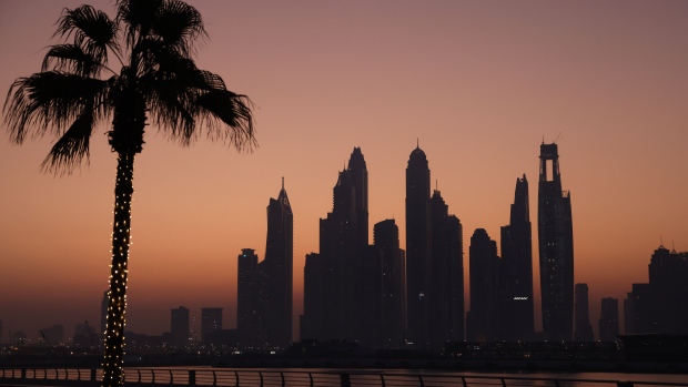 Skyscrapers on the city skyline at dawn in Dubai, United Arab Emirates, on Wednesday, Nov. 29, 2023. More than 70,000 politicians, diplomats, campaigners, financiers and business leaders will fly to Dubai to talk about arresting the world’s slide toward environmental catastrophe.