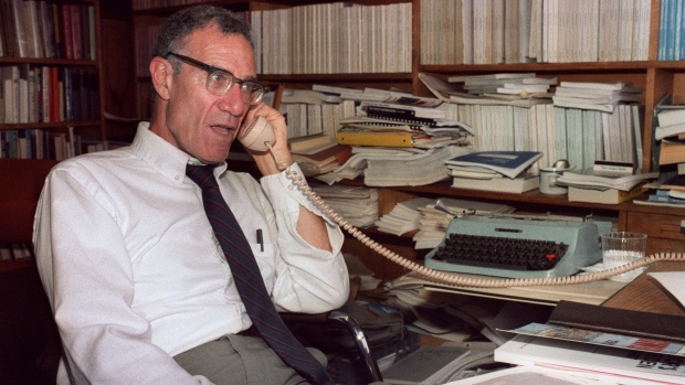 Robert Solow, winner of the 1987 Nobel Prize for Economics talks on the telephone in his office at the Massachusetts Institute of Technology, 21 October.  Photographer: Vin Catania/AFP/Getty Images