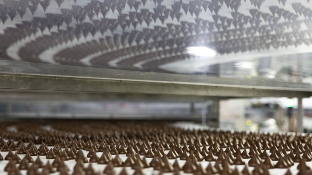 Hershey Kisses chocolate candies move along a conveyor at the company’s factory in Hershey, Pennsylvania, US, on Tuesday, March 21, 2023.