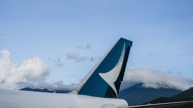 The tailfin of an aircraft operated by Cathay Cargo, the cargo unit of Cathay Pacific Airways Ltd., during a ceremony marking its rebranded livery at a HAECO Group hanger at Hong Kong International Airport in Hong Kong, China, on Wednesday, June 21, 2023. Cathay is one of the world's largest cargo airlines by freight capacity offered, operating out of Hong Kong, the world's busiest cargo hub. Photographer: Lam Yik/Bloomberg