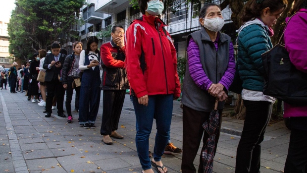 Voters queue at a polling station in Taipei during the last presidential election in 2020. Photographer: Betsy Joles/Bloomberg