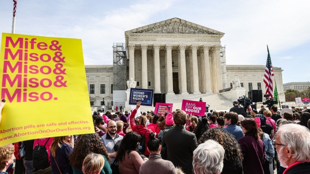 Demonstrators outside the US Supreme Court in Washington, DC, US, on Tuesday, March 26, 2024.  Photographer: Valerie Plesch/Bloomberg