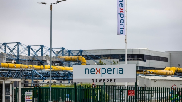 A Nexperia Holding BV sign at the entrance to the Richard Rogers-designed building at the Newport Wafer Fab in Newport, UK, on Thursday, Aug. 18, 2022. The UK government is deliberating whether to block a Chinese company from remaining the new owner of Newport Wafer Fab, exposing the political dilemma between supporting a key industry and keeping Beijing’s influence in check. Photographer: Hollie Adams/Bloomberg