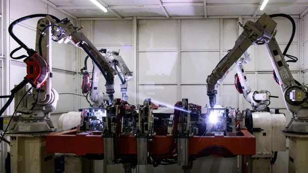 <p>Robotic arms operate at an EV battery case manufacturing facility in Muscle Shoals, Alabama, Oct. 4, 2023. </p>