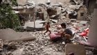 A child salvages objects after an overnight Israeli bombardment in Rafah, April 27. Photographer: -/AFP/Getty Images