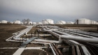 Oil transportation pipes and storage tanks stand in the Duna oil refinery, operated by MOL Hungarian Oil & Gas Plc, in Szazhalombatta, Hungary, on Monday, Feb. 13, 2019. Oil traded near a three-month high as output curbs by OPEC tightened global supply while trade talks between the U.S. and China lifted financial markets. Photographer: Akos Stiller/Bloomberg