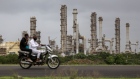 The Reliance Industries Ltd. oil refinery in Jamnagar, Gujarat, India, on Saturday, July 31, 2021. The Indian city of Jamnagar is a money-making machine for Asia's richest man, Mukesh Ambani, processing crude oil into fuel, plastics and chemicals at the world's biggest oil refining complex that can produce 1.4 million barrels of petroleum a day. Photographer: Dhiraj Singh/Bloomberg