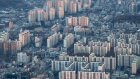 <p>Residential apartment buildings seen from the rooftop of the Lotte Corp. World Tower in Seoul.</p>