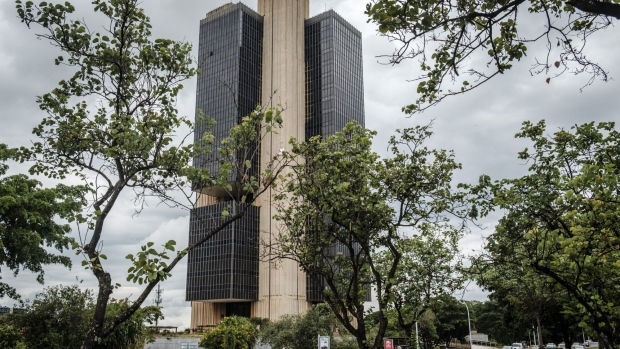 Trees stand in front of the Central Bank of Brazil headquarters in Brasilia, Brazil on Wednesday, Jan. 18, 2017. Foreign direct investment in Brazil soared to a six-year high in December as investors abroad kept an optimistic view of the country's long-term prospects, the central bank said. Photographer: Gustavo Gomes/Bloomberg