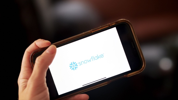 Snowflake Inc. signage is displayed on a smartphone in an arranged photograph taken in the Brooklyn borough of New York, U.S., on Wednesday, Sept. 16, 2020. Snowflake Inc. soared in a euphoric stock-market debut that transformed the eight-year-old software company into business valued at about $72 billion. Photographer: Gabby Jones/Bloomberg