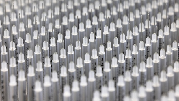 Low dead space syringes on a production line at a Shina Corp. factory in Gongju, South Korea, on Monday, Feb. 22, 2021. South Korea is scheduled to begin using AstraZeneca Plc's vaccine to inoculate patients and workers at nursing homes and related facilities who are younger than 65 from Feb. 26. Photographer: SeongJoon Cho/Bloomberg