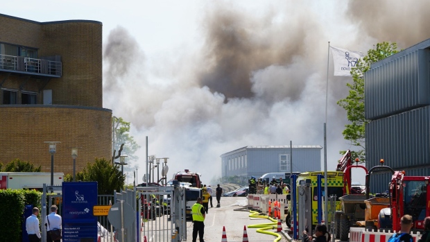 Firefighters at the scene of a blaze at the Novo Nordisk headquarters in Bagsvaerd, Denmark, on May 22. Photographer: Liselotte Sabroe/AFP/Getty Images