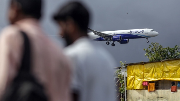 An aircraft operated by IndiGo prepares to land at Chhatrapati Shivaji Maharaj International Airport in Mumbai. Photographer: Dhiraj Singh/Bloomberg