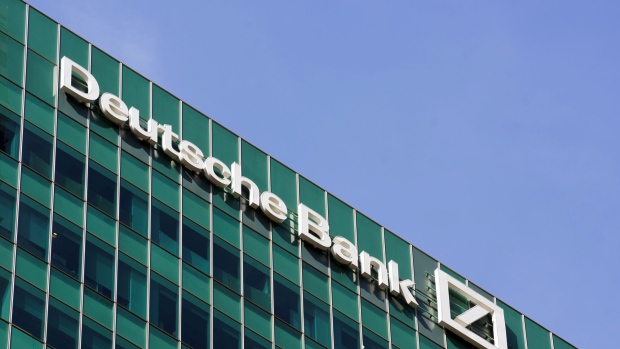Signage for Deutsche Bank AG atop the bank's office building in Singapore, on Thursday, April 18, 2024. Deutsche Bank plans to double the assets it manages for rich families in Southeast Asia and the Middle East over the next five years, tapping growing ties between ultra-rich clans in both regions, the lender's global private banking head said.