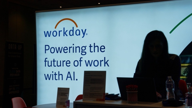 Workday signage at an exhibitor booth during The AI Summit New York 2023 in New York, US, on Wednesday, Dec. 6, 2023. The conference's agenda is designed to enable discovery of actionable insights to leverage AI for commercial success. Photographer: Bing Guan/Bloomberg
