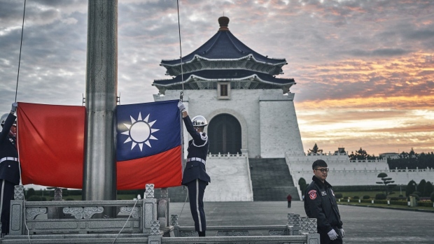 An honor guard during a flag raising ceremony at Chiang Kai Shek Memorial Hall in Taipei, Taiwan, on Wednesday, Dec. 27, 2023. Next month Taiwan holds presidential and legislature elections that will help shape US-China relations for years to come. Photographer: An Rong Xu/Bloomberg