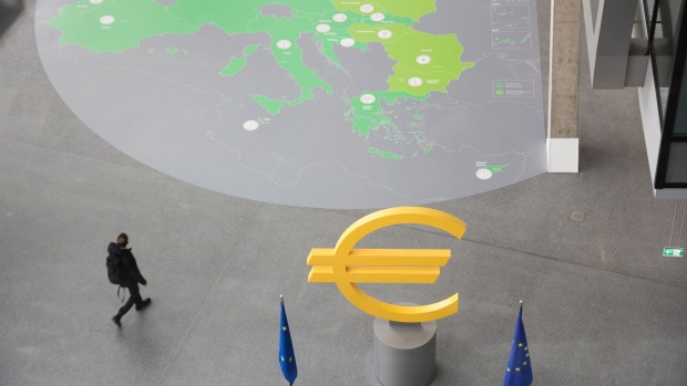 A Euro symbol sculpture at the European Central Bank headquarters in Frankfur. Photographer: Alex Kraus/Bloomberg